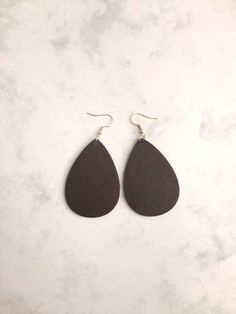 "Black Wood Teardrop Earrings These fun and trendy earrings are extremely lightweight in design. Perfect for all day wear into the evening. Choose from gold or silver hardware.   D E T A I L S Length: 2 inches long. Width: 1 1/2\" Color: Matte Black Handmade Teardrop Earrings.  Extremely lightweight to wear. Thank you for shopping with The Artisan Gift Shoppe." Wood Teardrop Earrings, Wood Dangle Earrings, Earrings Trendy, Black Boho, Artisan Gift, Trendy Earrings, Wood Earrings, Modern Earrings, Black Wood