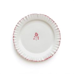 a white plate with pink flowers on it