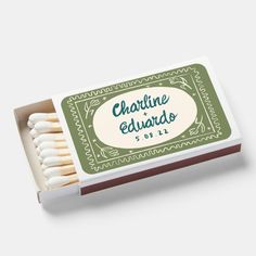 the matches are white and have green labels on them that read charine et elwards