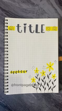 a notebook with yellow flowers and the word tuttle written in black ink on it