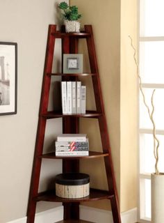 a wooden shelf with books on it in a living room next to a white rug