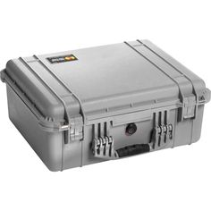 the pelican transport case is beige with wheels and latches on both sides