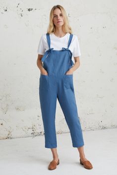 Casual Linen Jumpsuit, Blue Strap Jumpsuit, Linen Dungarees This Casual Linen Jumpsuit is minimal, handmade crafted from pure, soft-washed linen. With its slightly tapered silhouette, adjustable fit, and convenient side pocket, this versatile jumpsuit effortlessly combines comfort and style. Perfect for a sporty chic look or a casual ensemble, it pairs well with sneakers or heels. Whether attending a music festival or simply enjoying a day out, this long linen jumpsuit is a must-have. Give the gift of unique fashion to your loved ones who value both style and comfort. Embrace minimalist elegance with our perfect summer linen romper. D E S C R I P T I O N * Loose fit style  * Sleeveless * Two front pockets * Tapered / slim leg * Straight cut * Sizes: XS - XXL * 100% linen * European soft an Blue Shortalls With Pockets, Blue Denim Bib Front Jumpsuit With Pockets, Blue Bib Front Denim Jumpsuit With Pockets, Blue Denim Jumpsuit With Bib Front And Pockets, Blue Overalls With Pockets, Casual Blue Shortalls For Work, Casual Blue Workwear Shortalls, Blue Sleeveless Shortalls With Pockets, Blue Overall Jumpsuit For Work