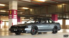 a silver car parked in a parking garage