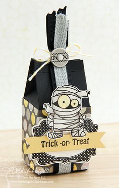 an origami box with a trick - or - treat tag attached to it