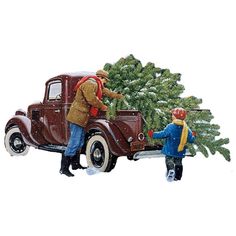 an old truck with a christmas tree in the back and two people standing next to it