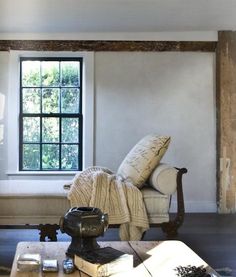 a living room filled with furniture and a window