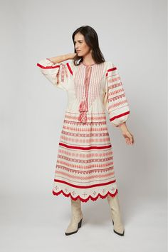 With its feminine shape and exquisite embroidery and details by Larkin Lane, the Kateryna dress from Ukraine is a "one decision" outfit that speaks volumes about your style. The beauty of this textile tradition takes center-stage and can be paired with simple accessories, wedges, boots, or sandals. Versatile enough to go from sightseeing to celebrations; and did we mention... she has pockets?? Embroidery is a fundamental part of the Ukrainian folk art tradition dating back to the 5th century. La Festive Off-white Dress With Intricate Embroidery, Off White Dress With Intricate Embroidery For Festive Occasions, Fitted Folk Dress With Resham Embroidery, Traditional Spring Dress With Embroidered Neckline, Folk Style Red Long Sleeve Dress, Folk Style Maxi Dress With Intricate Embroidery, Red Embroidered Maxi Length Dress, Cream Maxi Dress With Resham Embroidery, Red Maxi Dress With Intricate Embroidery