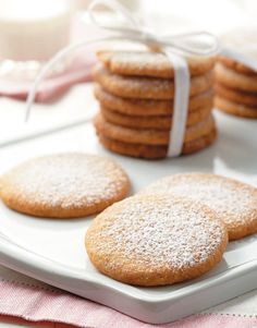 some sugar cookies are on a white plate