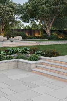 an outdoor garden with steps leading up to it