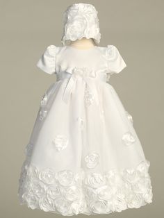 Details This floral ribbon tulle Christening gown is beautifully detailed for your little girls special day. The elegant full tulle gown has floral ribbon roses on the skirt and is finished with three rows of ribbon roses all along the bottom hem and along the bonnet. A satin bow and flower adorn the sash at the waist. Cap sleeves. Sizes Available: X-Small (0-3 Months), Small (3-6 Months), Medium (6-12 Months), and Large (12-18 Months) 100% Polyester. Hand Wash Cold - Do Not Use Bleach - Hang Dr Tulle Baptism Dress With Floral Applique For First Communion, First Communion Dress With Floral Applique For Baptism, First Communion Tulle Dress With Floral Applique, Tulle Baptism Dress With Floral Applique For Wedding, Fitted Tulle Baptism Dress With Floral Applique, Fitted Tulle First Communion Dress With Floral Applique, Fitted Organza Ball Gown For First Communion, Wedding Baptism Dress With Floral Applique, Tulle Baptism Dress With Satin Bow For First Communion