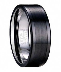 an image of a black wedding ring on a white background