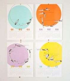 four colorful calendars hanging on the wall