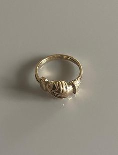 Victorian Fede Gimmel Clapsing Hands Ring  Gimmel rings trace their history back to Medieval Europe and symbolise respect, fidelity, and commitment. This ring looks like it orginally opened, but has been soldered closed Size: P 1/2 UK/ 8.25 US/ Euro 57.5 Weight: 4.4g Gimmel Ring, Medieval Europe, Etsy Gold Ring, Hand Ring, Rings Statement, Gold Ring, Statement Rings, Beauty Book, Gold Rings