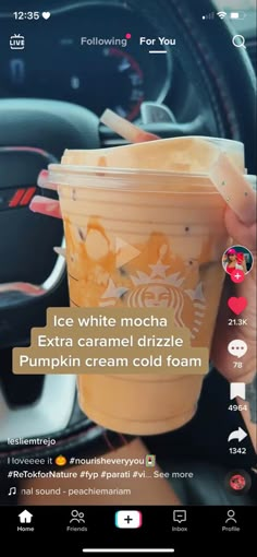 someone holding up a cup in their hand while sitting in a car with the text, ice white macha extra caramel drizle pumpkin cream cold foam