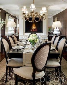 a formal dining room set up with fancy chairs