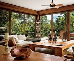 a living room filled with furniture and lots of windows