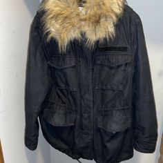 great condition draw string, pockets, gold tone hardware  velcro closure on sleeves Excellent Black Jacket With Fur, Black Fluffy Hooded Outerwear, Tommy Hilfigure Black Parka Fur Hood, Black Faux Fur Outerwear With Padded Collar, Black Fluffy Faux Fur Outerwear, Faux Fur Collar, Parka Jacket, Fur Collars, Size 12