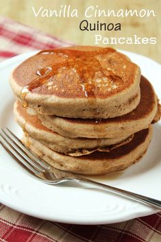 a stack of pancakes sitting on top of a white plate next to a knife and fork