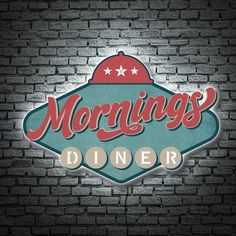 the logo for mornings diner is shown on a brick wall in front of a dark background