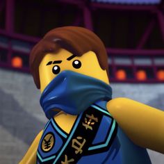 the lego movie character is holding his arm over his face