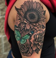 a woman with a sunflower and butterfly tattoo on her arm