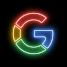 the google logo is lit up with neon lights