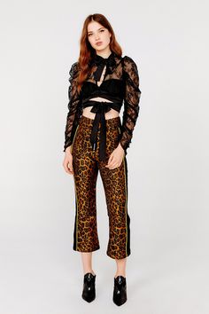 The Farrah Button-Up Blouse from For Love & Lemons is an elegant lace top that features a front keyhole neckline with tie and center front button closure. It has draped long puff sleeves and a wrap around tie at the waist. Partially lined. Model is a 34B and wears size S. Self: 57.5% Nylon/42.5% Polyester; Contrast: 92% Polyester/8% Spandex; Lining: 97% Polyester/3% Spandex Elegant Lace Tops, Victoria Secret Shops, Keyhole Neckline, For Love & Lemons, Floral Crop Tops, Long Puff Sleeves, For Love And Lemons, Black Blouse, For Love