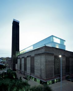 the building is made out of bricks and has a glass roof on it's side