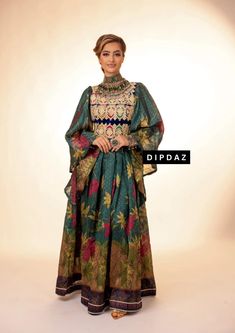 Explore our exclusive collection of Afghan dresses at Dipdaz, where tradition meets modern elegance. Our range includes stunning Afghan bridal dresses, wedding dresses, and ethnic dresses, perfect for every occasion from weddings to henna parties. We also offer luxury Afghan dresses, modest designs, and casual wear, ensuring there's something for everyone. Key Features: Customizable & Personalized: Each dress can be tailored to your preferences, including sleeve length and neckline style. Availa Semi-stitched Anarkali Dress With Traditional Patterns, Anarkali Style Floor-length Kaftan With Traditional Patterns, Semi-stitched Bollywood Dress With Traditional Patterns, Bohemian Long Sleeve Designer Dress, Multicolor Dabka Work Designer Dress, Anarkali Kaftan For Traditional Ceremonies, Multicolor Semi-stitched Dabka Dress, Transitional Jamawar Dress With Zari Work, Bollywood Style Floor-length Jamawar Dresses