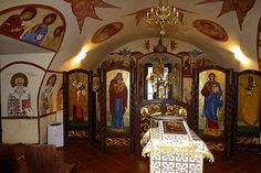 the interior of a church with paintings on the walls