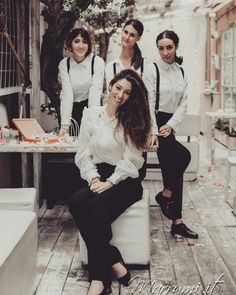 a group of women standing next to each other