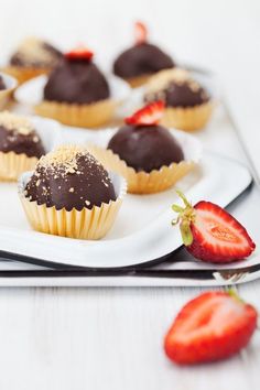 chocolate covered strawberries are sitting on a plate