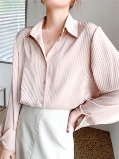 Take charge of your style and create the look you desire with our Vertical Striped Silky Blouse. This versatile blouse offers a slim-fit, making it your go-to piece for an array of fashion-forward outfits. Featuring long sleeves, a classic collar, and a subtle vertical striped pattern, this blouse pairs well over your solid tees and turtlenecks or shines as a stand-alone piece tucked into your favorite trousers. Vertical Striped Shirt, Striped Shirt Women, Silky Blouse, Chic Top, Women Blouses, Loose Shirts, Elegant Shirt, Spring Shirts, Loose Blouse