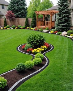 a garden with green grass and flowers in the middle