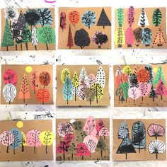 several different types of trees on brown paper