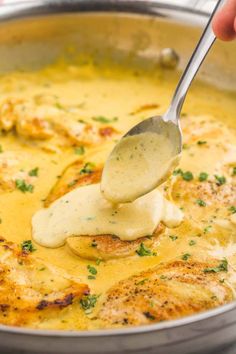 a person is spooning some food out of a pan