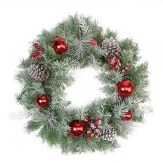 a christmas wreath with pine cones and red baubles on white background stock photo