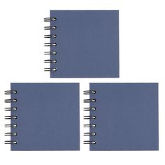 three spiral bound notebooks with blue covers