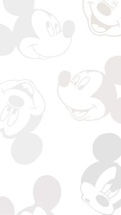 the mickey mouse wallpaper is white and has grey circles on it, as well as two