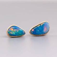 Minimalist Free Shaped Australian Doublet Opal Stud Earrings 18K Yellow Gold. Free Domestic USPS First Class Shipping! Free Gift Bag or Box with every order!Opal—the queen of gemstones, is one of the most beautiful gemstones in the world. Every piece of opal is unique in its own ways and patterns. We only use high-quality Natural Opals (NO synthetics or imitations) for our jewelry. ----------------------------------------------------------------------------------------------------ABOUT THIS PROD Yellow Gold Opal Gemstone Earrings, Formal Opal Gemstone Earrings, Opal Promise Ring, Rings For Couples, Opal Stud Earrings, Australian Black Opal, Opal Birthstone, Beautiful Gemstones, Promise Rings For Couples