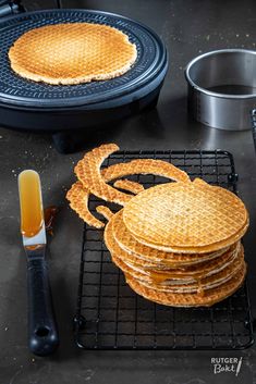 some waffles are stacked on top of each other and ready to be cooked