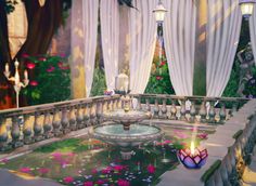 a fountain in the middle of a garden filled with flowers and candles next to white drapes