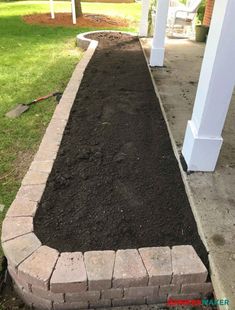 a garden bed with dirt in the middle