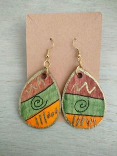 Hand painted wooden earrings with alcohol inks Artistic Hand Painted Brown Earrings, Artistic Hand Painted Brown Jewelry, Hand Painted Orange Earrings As Gift, Artsy Hand Painted Dangle Earrings, Green Hand-painted Bohemian Earrings, Green Hand Painted Bohemian Earrings, Brown Hand Painted Teardrop Jewelry, Bohemian Hand Painted Brown Earrings, Bohemian Brown Hand Painted Earrings