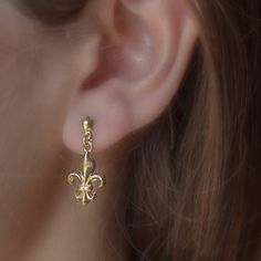 Delicate & Elegant Fleur de Lys earrings, for everywhere you go Medieval gold plated earrings for special event Perfect for birthday gift *With lovely packing* ✨ D I M E N S I O N S & V A R I A T I O N S✨ The diameter of the pendant is 0.4 inches (11mm) and the length is 0.98 inches (25mm) including the hook. ✨ M A T C H I N G J E W E L S ✨ If you really like this French Heraldry we have a small but beautiufl collection of it. Some recommendations are on the following links: Fleur de Lys Medieval Jewelry Earrings, Medieval Gold Jewelry Gift, Medieval Style Gold Jewelry For Gift, French Heraldry, Medieval Symbols, Medieval Earrings, Medieval Jewelry, Cluster Earrings, Lovely Earrings