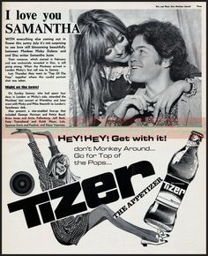 an advertisement for tizer beer with two women kissing and one man holding a bottle