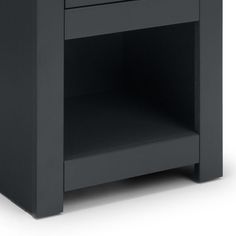 a black night stand with one drawer open