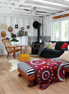 a living room filled with furniture and a fire place