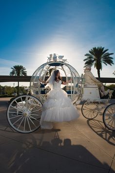 the bride and groom are riding in a horse drawn carriage